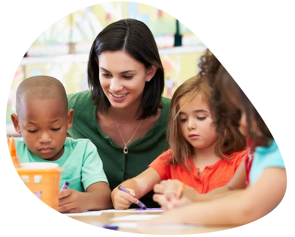 a nursery teacher guiding children a nursery teacher guiding children
